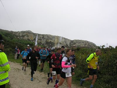 Marathon runners leave start line Holyhead Country Park